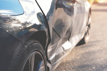 close up of damaged car door after accident 