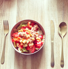 Nutritious salad with veggies and tuna is a healthy meal choice, providing balanced nutrients for wellbeing
