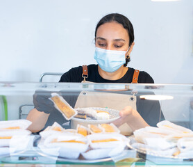 Moroccan woman working in her small Moroccan sweets business