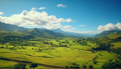 Fototapeta premium A stunning spring day landscaping views of fertile land surrounded beautiful green vegetation, wide stretches of hills and mountains with clear skies in spring