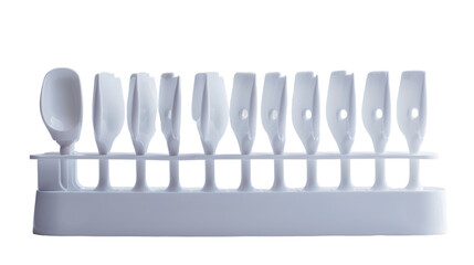 Assorted knives neatly arranged in a row on a metal rack