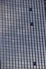 Three open windows in a glass skyscraper in a vast metropolis. Glass building.