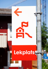 sign with the text playground and an icon