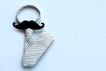 Happy Father's Day. Top view of necktie and false mustache with copy space for text