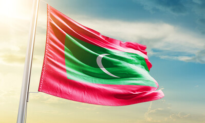 Maldives national flag waving in beautiful sky.