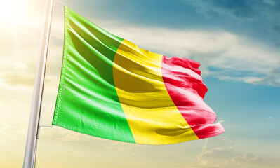 Mali national flag waving in beautiful sky.