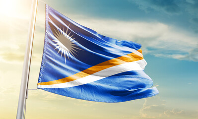 Marshall Islands national flag waving in beautiful sky.