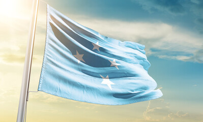 Micronesia national flag waving in beautiful sky.