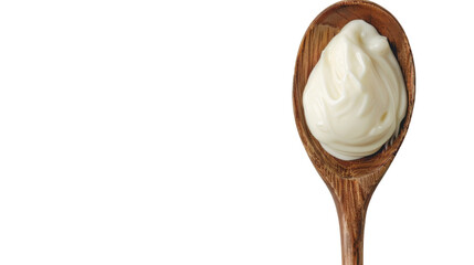 A wooden spoon filled with whipped cream on a neutral background