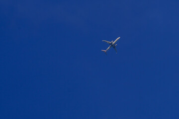 Commercial Airplane Flying in Clear Blue Sky