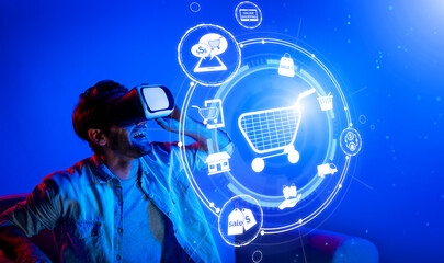 Happy man using VR headset and shopping online while sitting at sofa with shopping bags. Smart person looking at online market hologram and icon with neon background. Innovation technology. Deviation.