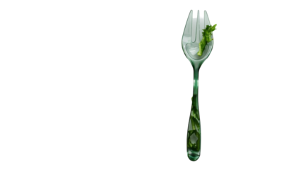 A green leaf resting on a fork, creating a simple yet striking contrast