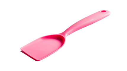 A pink spatula placed on a plain white surface