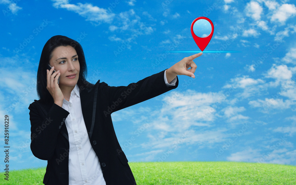 Poster businesswoman talking on her cell phone and pointing finger to map pin point location button over gr