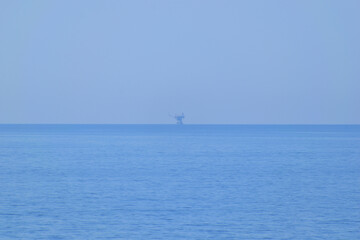 Naklejka premium marine oil terminal in cloud - Prinos oil area, near Thassos, Greece, aegean sea