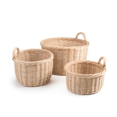 Obraz premium Three natural woven wicker baskets of different sizes, perfect for storage or decor, arranged on a white background.