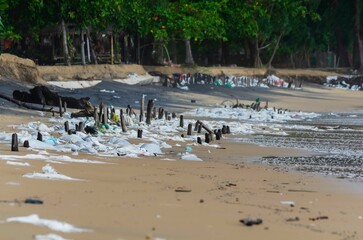 garbage on the baech pollution the shore of a tropical beach highlights the worldwide plastic pollution crisis even