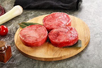 Delicous raw tuna medallion for cooking