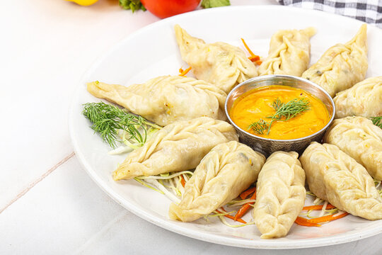 Steamed asian dumpling momo with meat