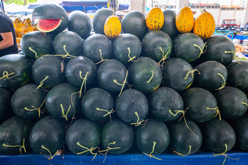 Watermelon for sale at local tropical fruit market.