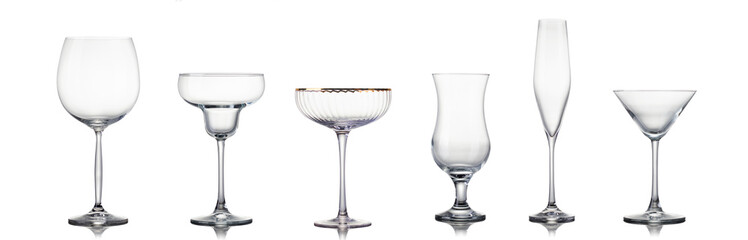 Set of different empty glasses for drinks and cocktails on white background