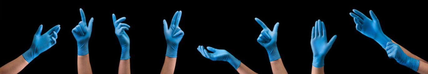 Doctor's hand in sterile medical gloves showing gesture or something on black