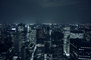 City Skyline at Night: Aerial View of Illuminated Skyscrapers