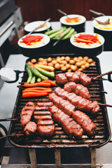 Grilled meat feast: BBQ with juicy sausage and tender beef on the grill