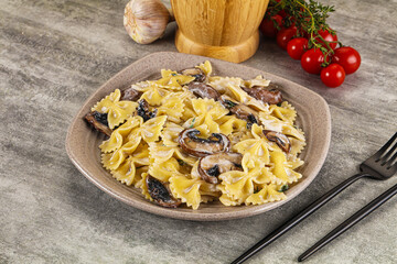 Italian cuisine - farfalle with mushrooms