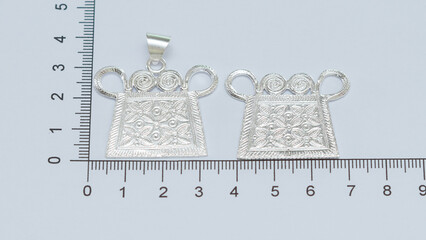 Handmade silver jewelry display on white background