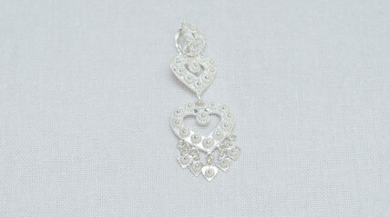 Silver jewelry display on white background