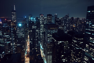 Obraz premium Aerial Night View of Skyscrapers from Drone's Perspective