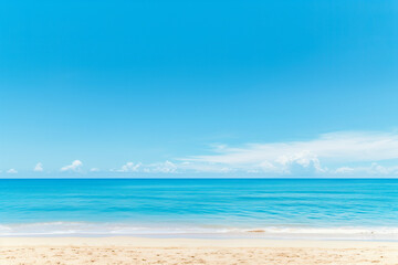 Obraz premium Sunlit Beach with Blue Sky and Ocean View