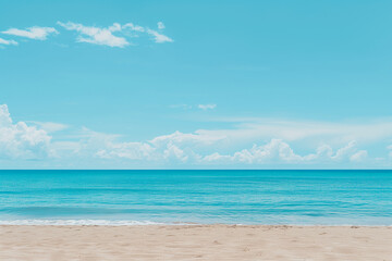 Fototapeta premium Sunlit Beach with Blue Sky and Ocean View