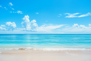 Obraz premium Sunlit Beach with Blue Sky and Ocean View