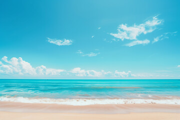 Obraz premium Sunlit Beach with Blue Sky and Ocean View
