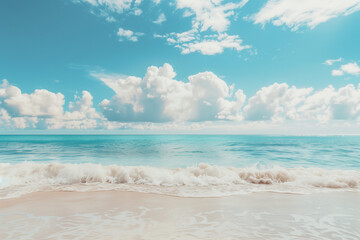 Obraz premium Sunlit Beach with Blue Sky and Ocean View