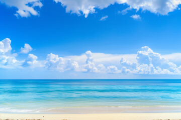 Obraz premium Sunlit Beach with Blue Sky and Ocean View