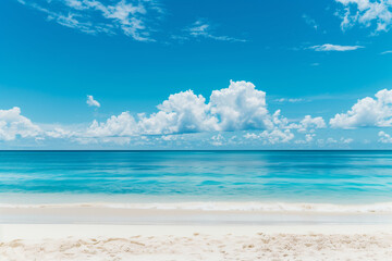 Obraz premium Sunlit Beach with Blue Sky and Ocean View