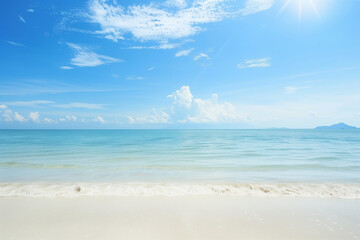 Fototapeta premium Sunlit Beach with Blue Sky and Ocean View