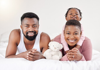 Black family, portrait and relax with teddy bear on bed for bonding, weekend or morning together at...