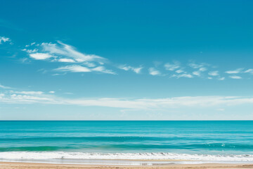 Fototapeta premium Sunlit Beach with Blue Sky and Ocean View