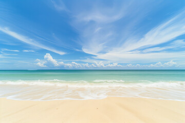 Obraz premium Sunlit Beach with Blue Sky and Ocean View