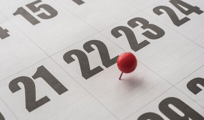 22nd of the month on the calendar marked with a red ball. Twenty-second day of the month marked...
