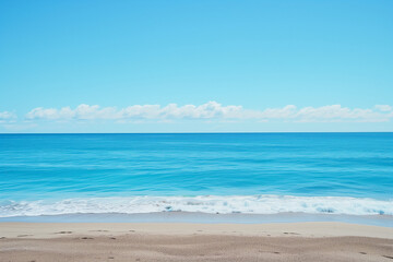 Fototapeta premium Sunlit Beach with Blue Sky and Ocean View