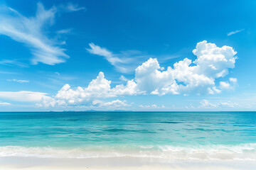 Obraz premium Sunlit Beach with Blue Sky and Ocean View