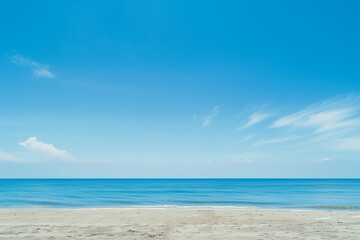 Sunlit Beach with Blue Sky and Ocean View