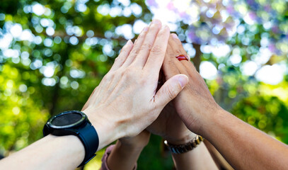 Teamwork Concept,Group of diversity people to greeting power tag team,Teamwork Join Hands...