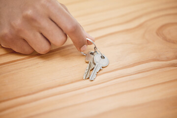 House, keys and hands for purchase on table, real estate and relocate or buy property. Person,...
