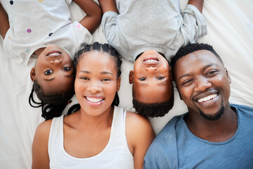 Top view, bed and portrait of parents with children bonding, happiness and having fun on weekend....